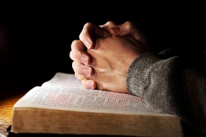 bigstock-Praying-Hands-Man--Bible-2780594